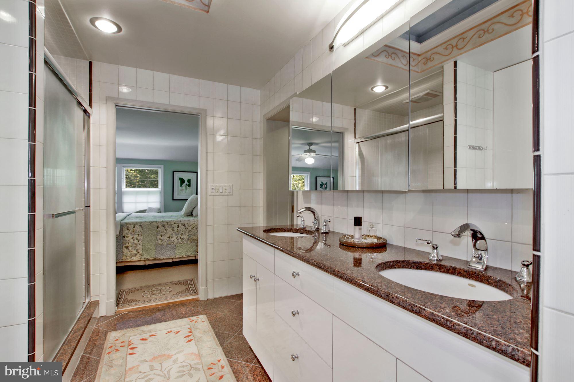 9409 Brooke Drive Bethesda, MD 20817 - Photo 26 of 47 Owner's spa bath with dual sinks