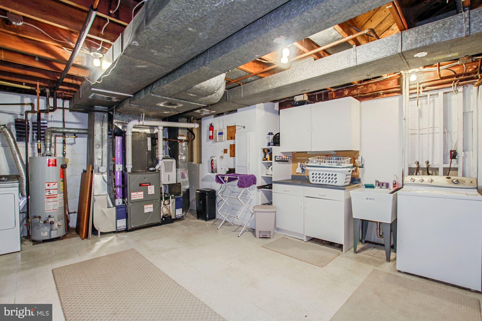 9409 Brooke Drive Bethesda, MD 20817 - Photo 41 of 47 Expansive storage / utility / laundry /hobby space