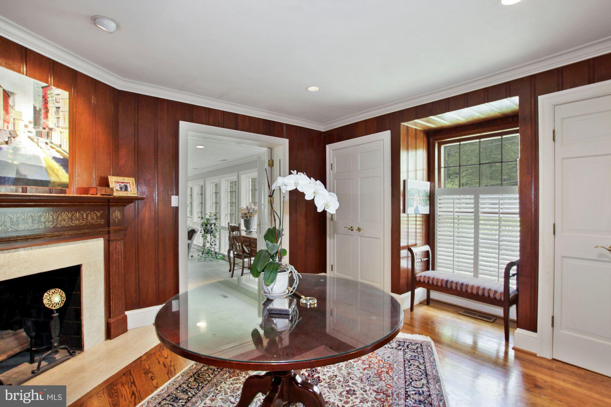 9409 Brooke Drive Bethesda, MD 20817 - Photo 10 of 47 Den of entry foyer complete with fireplace
