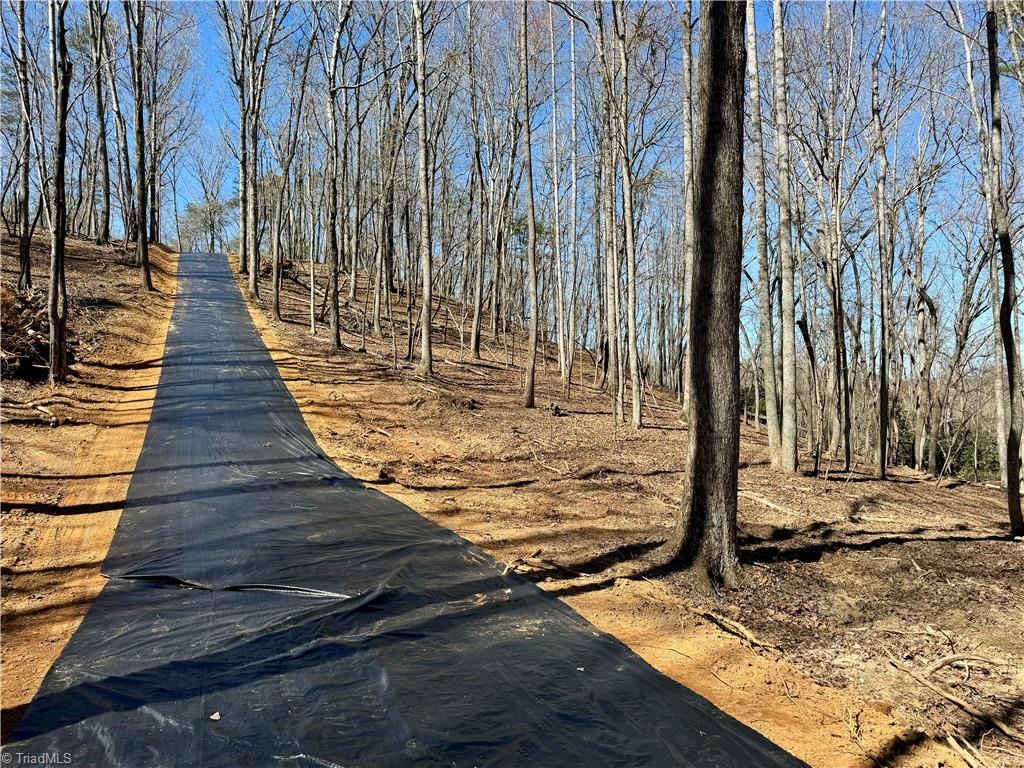 475 Fisher Valley Road Dobson, NC 27017 - Photo 40 of 50 2,100' of driveway built on top of geofabric to keep gravel from sinking ovwer time, able to take years of heavy travel