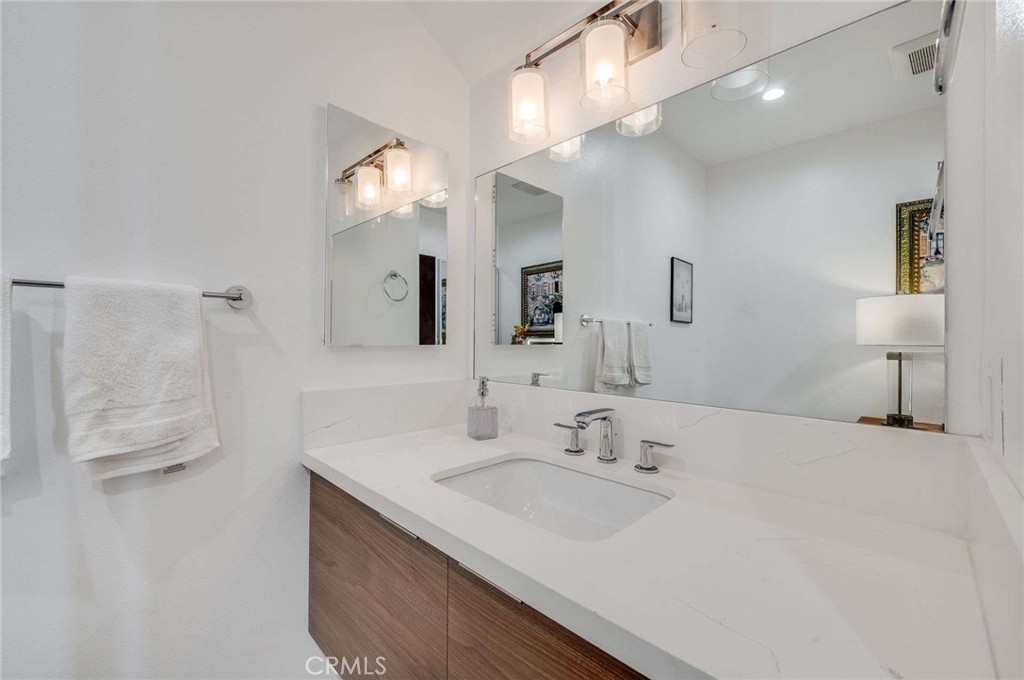 11837 Rideout Way Whittier, CA 90601 - Photo 21 of 44 a bathroom with a sink double vanity and a mirror