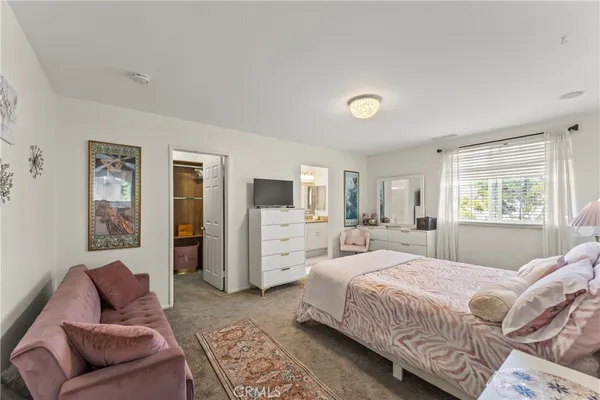 a bedroom with a bed and furniture