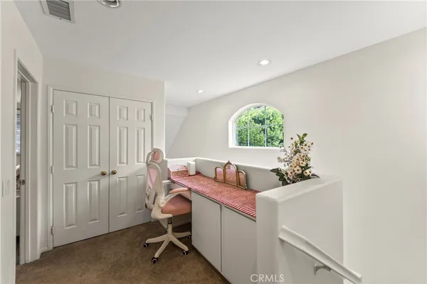 a workspace with furniture and window