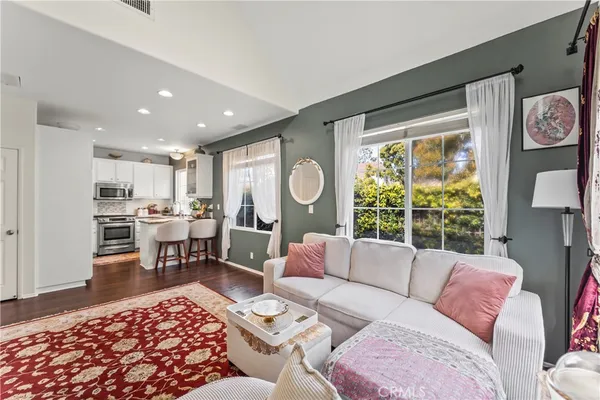 a living room with furniture and a large window