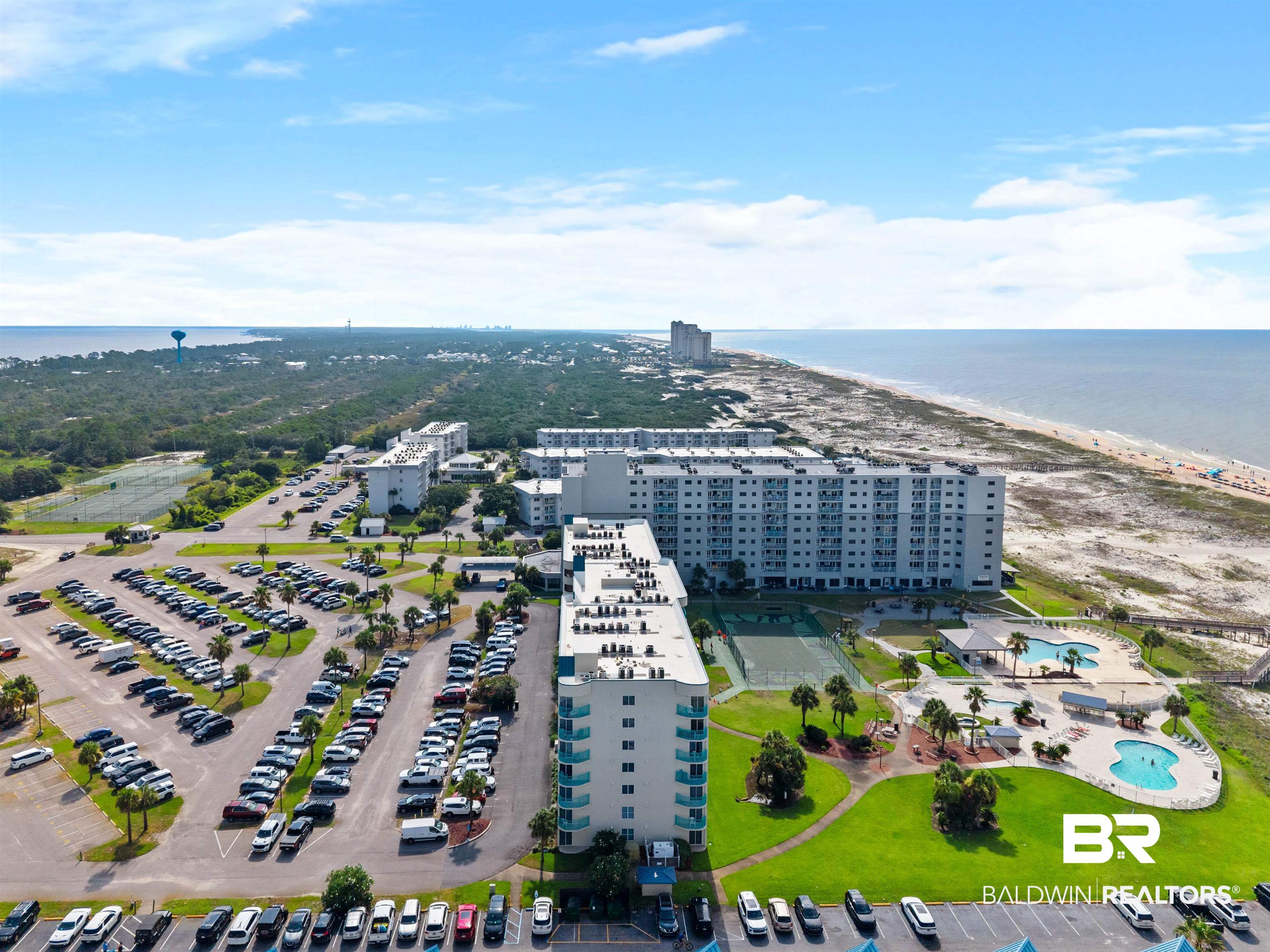 645 Plantation Road, Unit 6606 Gulf Shores, AL 36542 - Photo 2 of 60 Coastal property featuring multiple buildings, direct beach access, multiple outdoor swimming pools, tennis courts, and ample parking