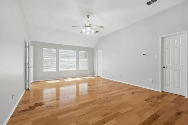 a view of an empty room with a window