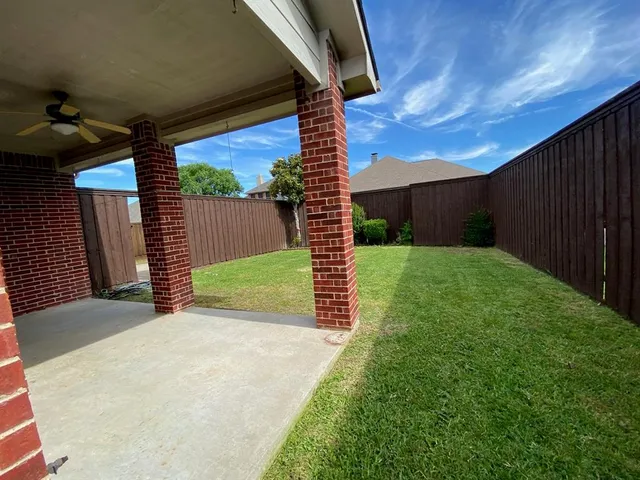 a view of a backyard with a garden