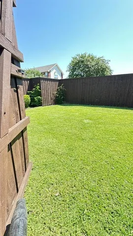 a view of a backyard with garden