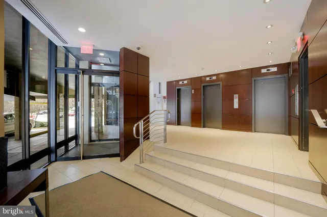 a bathroom with a tub and a large mirror