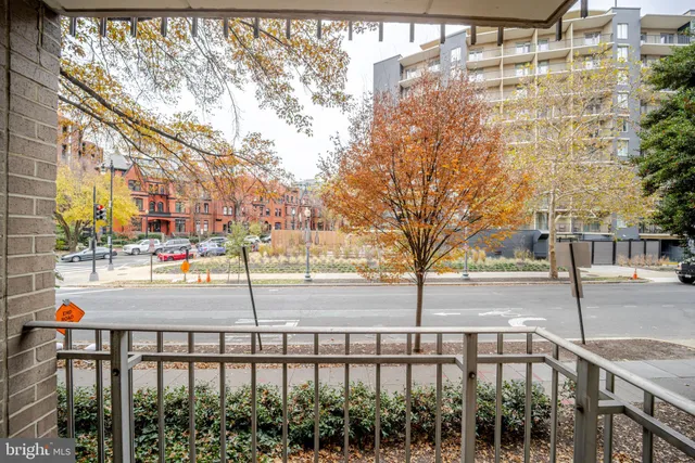 a view of a street with a building