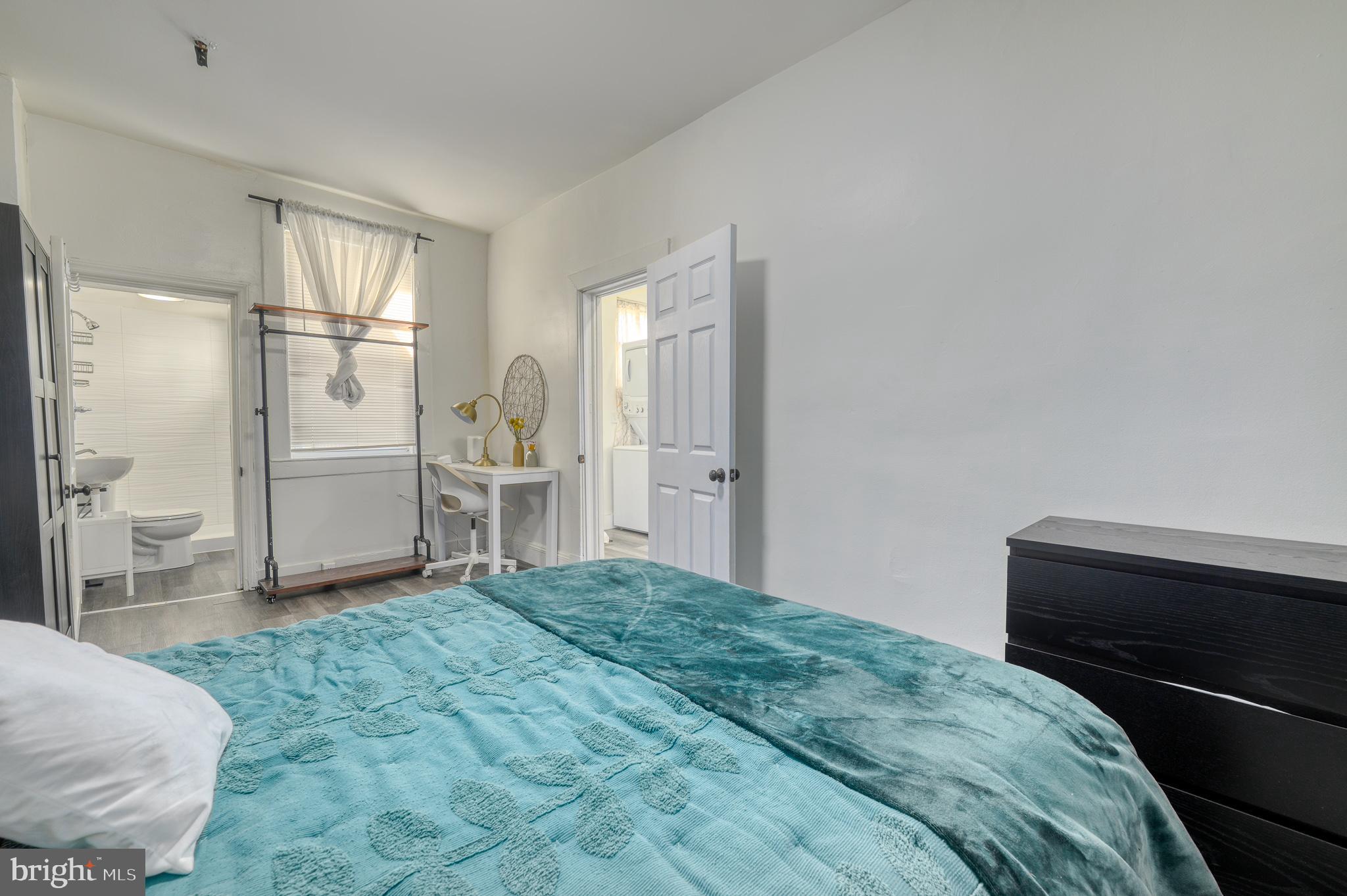 7104 Harford Road Baltimore, MD 21234 - Photo 33 of 37 a bedroom with a bed and a view of bathroom