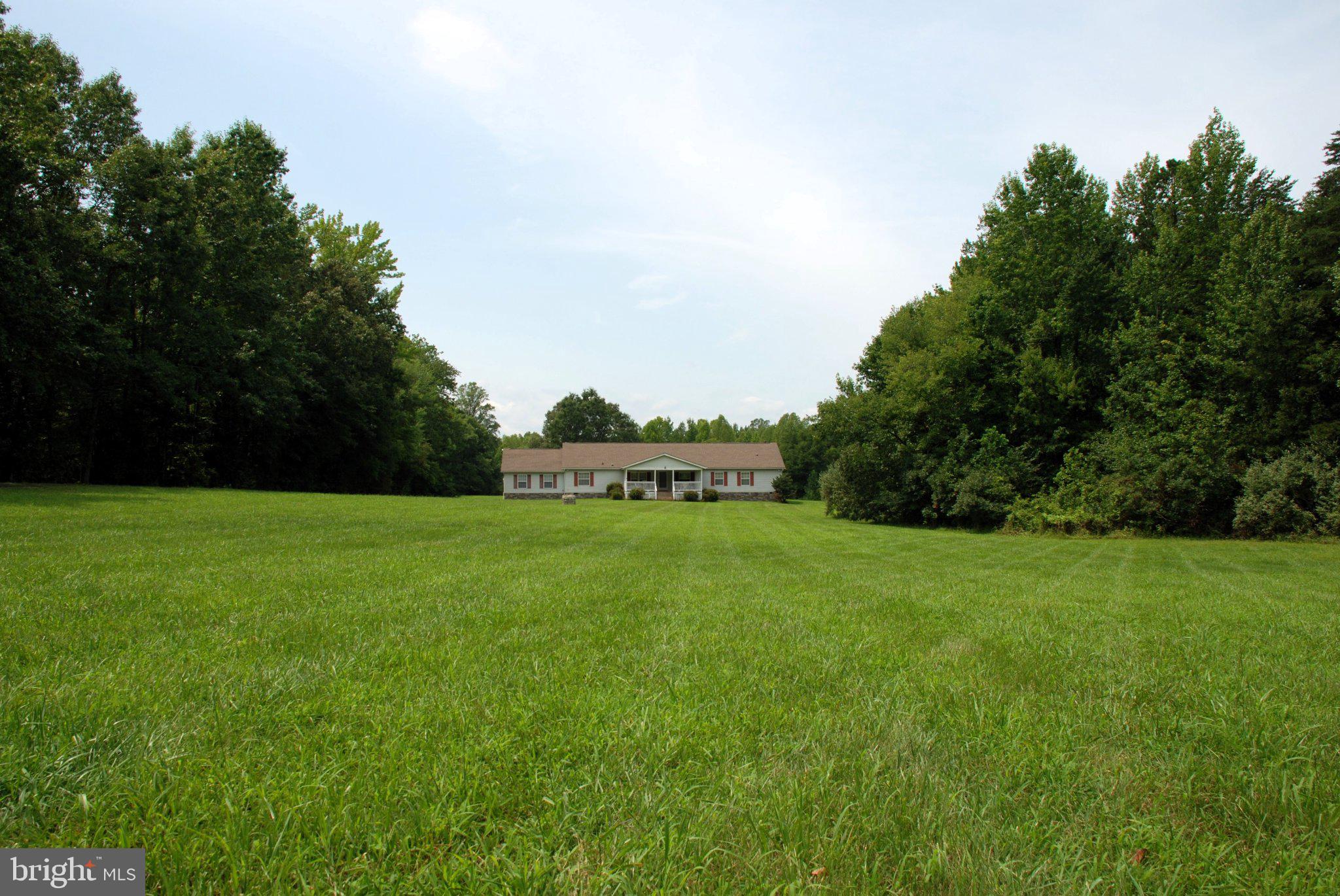 4508 Lewiston Road Bumpass, VA 23024 - Photo 2 of 84 Spacious home nestled in lush greenery.