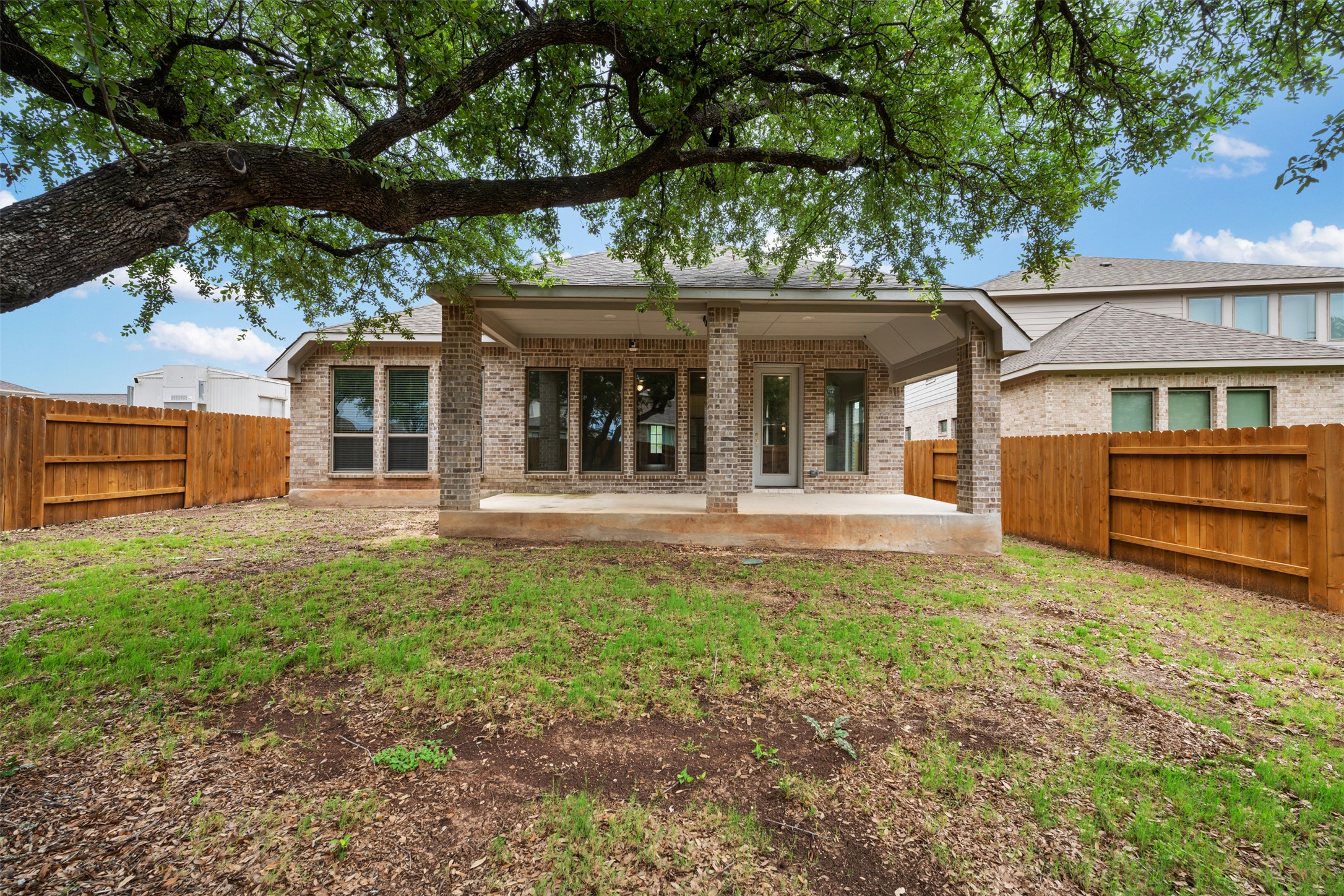 104 Anejo Bluff Georgetown, TX 78628 - Photo 37 of 40 front view of a house with a tree in front of it