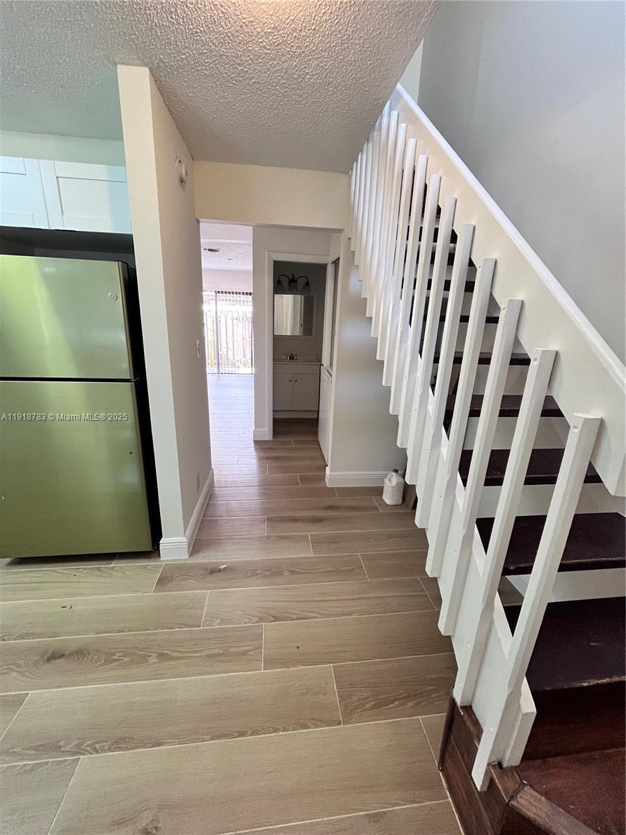 3281 East Golf Boulevard, Unit 12 Pompano Beach, FL 33064 - Photo 10 of 21 a view of entryway with wooden floor