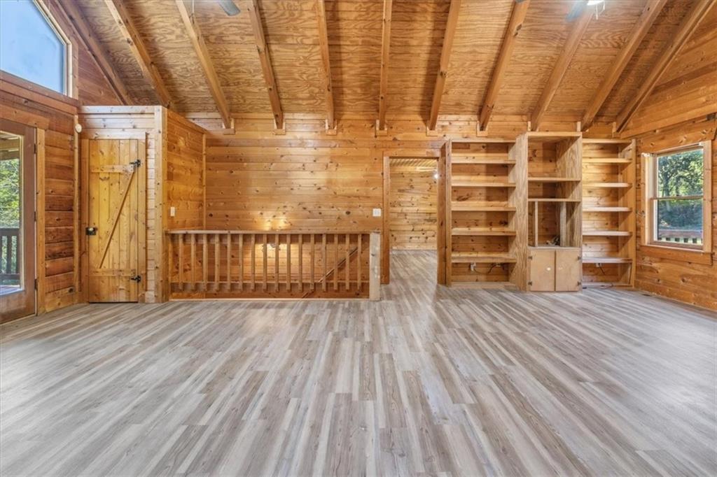 910 Brushtown Road Cisco, GA 30708 - Photo 15 of 30 an empty room with wooden floor and windows