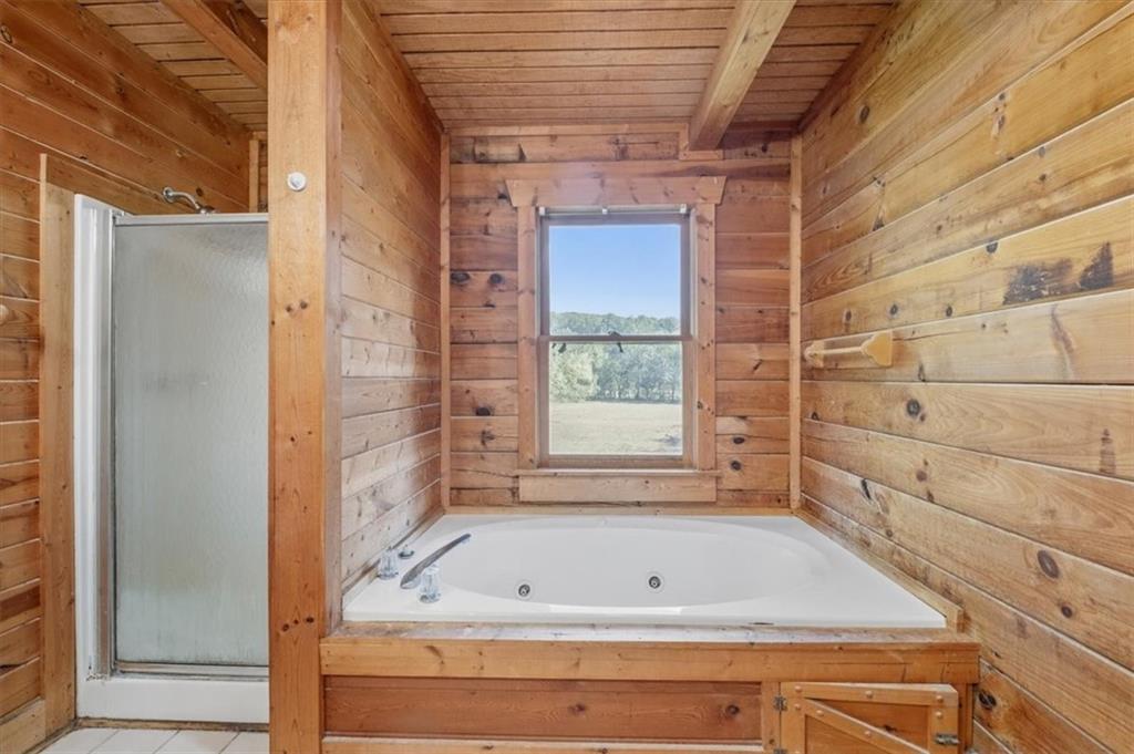 910 Brushtown Road Cisco, GA 30708 - Photo 22 of 30 a bathroom with a tub and shower