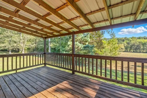 a view of balcony with wooden floor