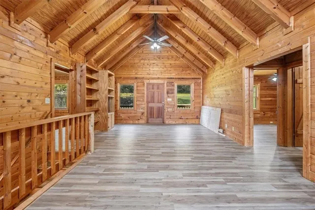 a view of a hall with wooden floor