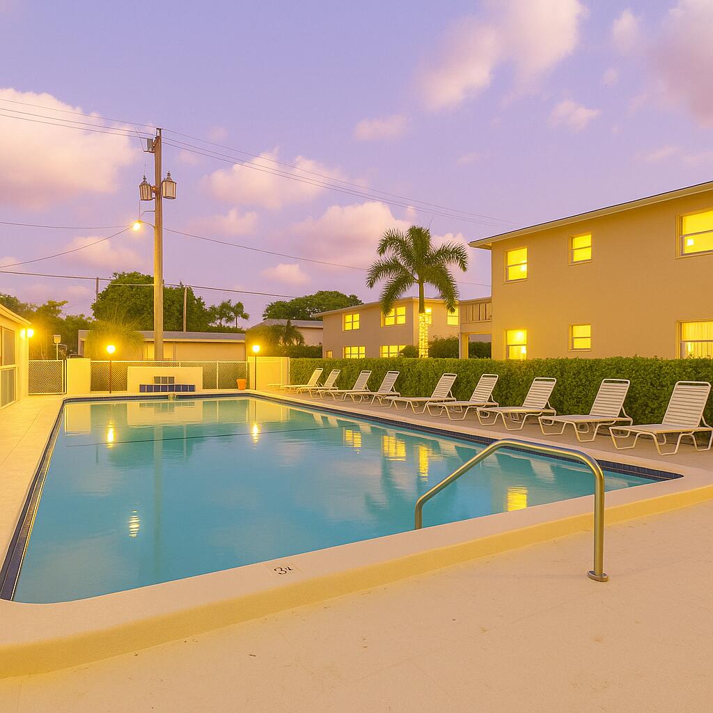 2131 Northeast 42nd Court, Unit 210E Lighthouse Point, FL 33064 - Photo 23 of 26 Twilight Pool Photo