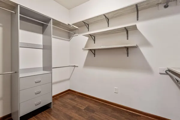 a kitchen with stainless steel appliances granite countertop a refrigerator a stove top oven a sink and dishwasher