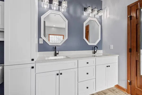 a kitchen with granite countertop a stove top oven and sink