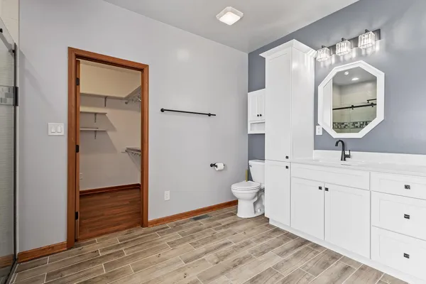 a kitchen with stainless steel appliances granite countertop a stove microwave and sink