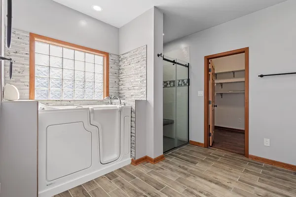 a large kitchen with stainless steel appliances granite countertop a stove and a sink