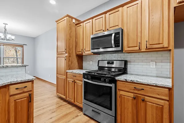a balcony with chairs and a table