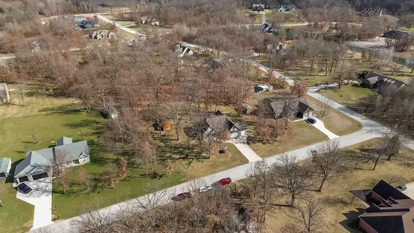 a aerial view of residential houses with outdoor space