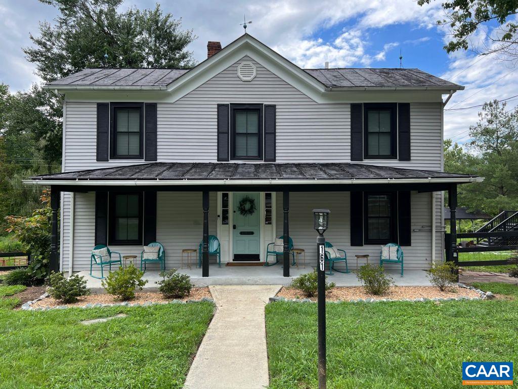 161 Avon Road Afton, VA 22920 - Photo 1 of 39 a front view of a house with a yard and potted plants