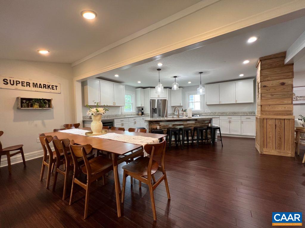 161 Avon Road Afton, VA 22920 - Photo 12 of 39 a kitchen with stainless steel appliances a dining table chairs and wooden floor
