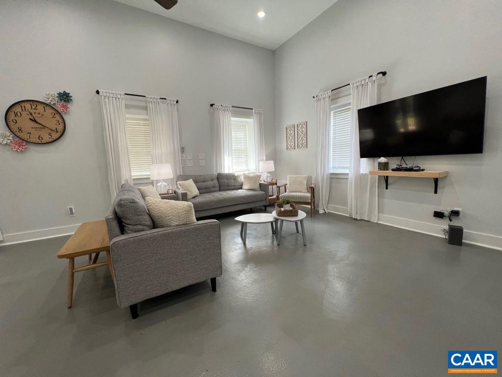 161 Avon Road Afton, VA 22920 - Photo 24 of 39 a living room with furniture and a flat screen tv