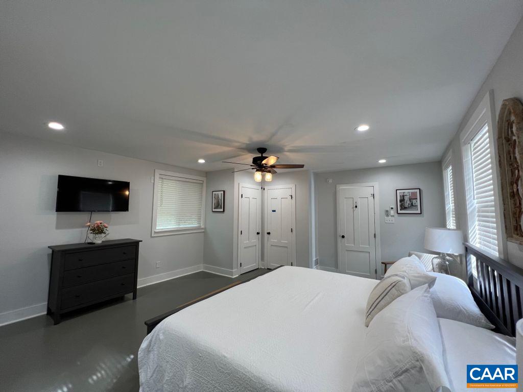 161 Avon Road Afton, VA 22920 - Photo 33 of 39 a bedroom with a bed and a flat screen tv