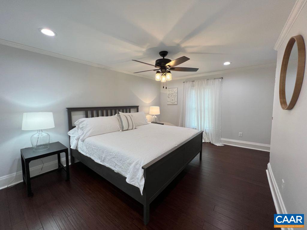 161 Avon Road Afton, VA 22920 - Photo 6 of 39 a bedroom with a bed and a chandelier