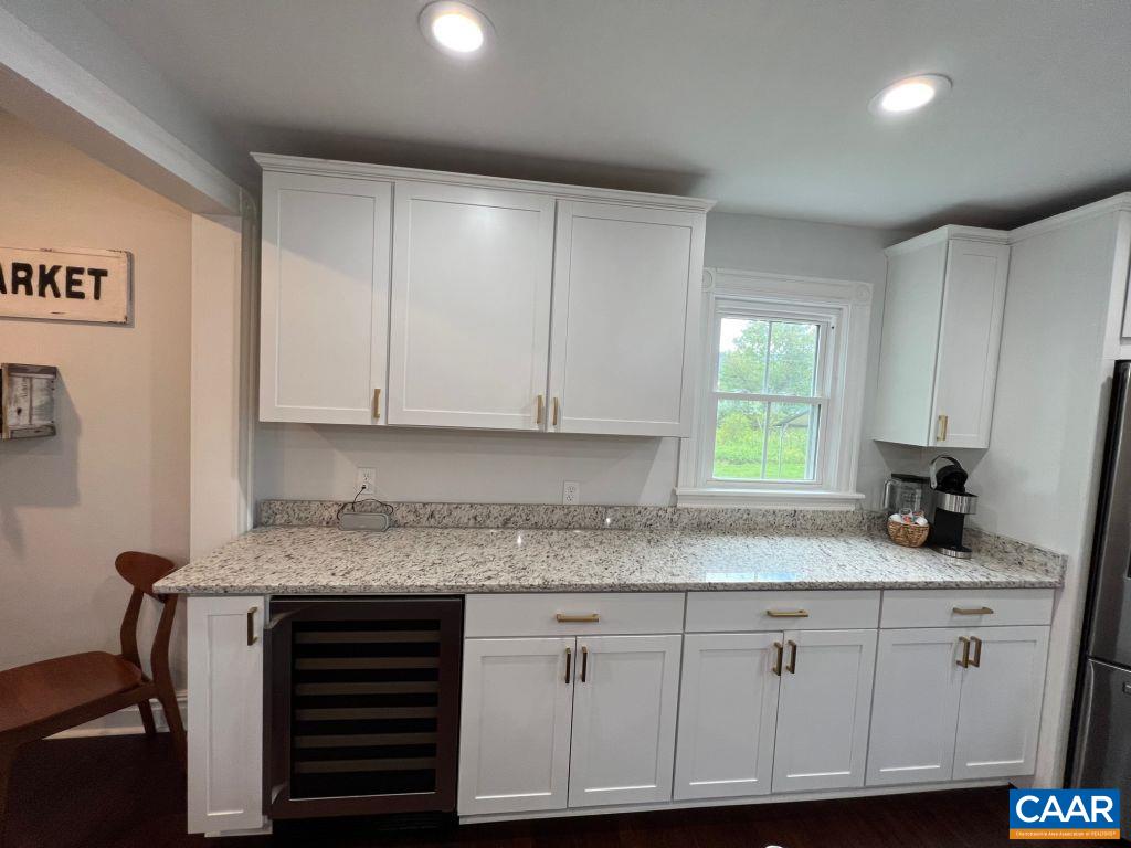 161 Avon Road Afton, VA 22920 - Photo 9 of 39 a kitchen with granite countertop a sink cabinets and window