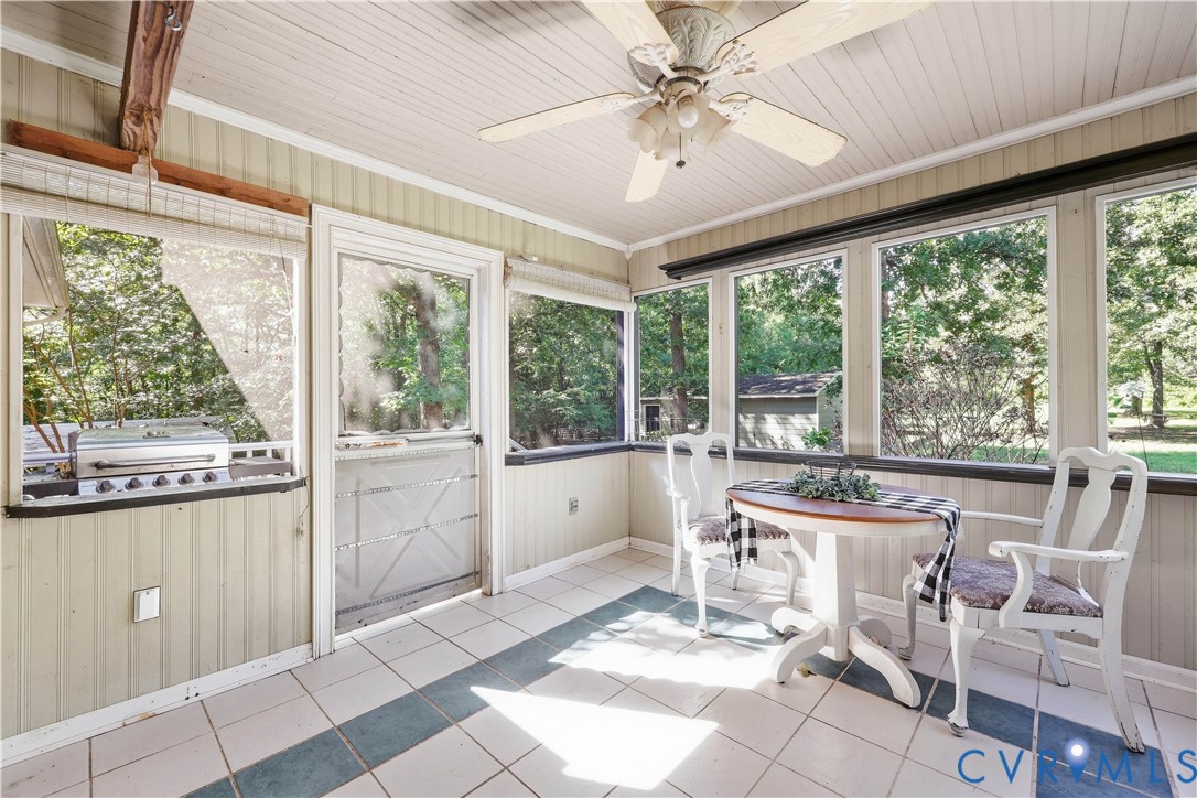 3046 Davis Mill Road Goochland, VA 23063 - Photo 21 of 40 Enclosed porch with paneling, tile flooring, and m