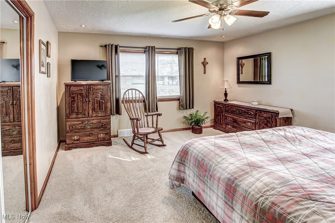 4234 Grafton Road Brunswick, OH 44212 - Photo 15 of 40 Carpeted bedroom with a textured ceiling and ceiling fan