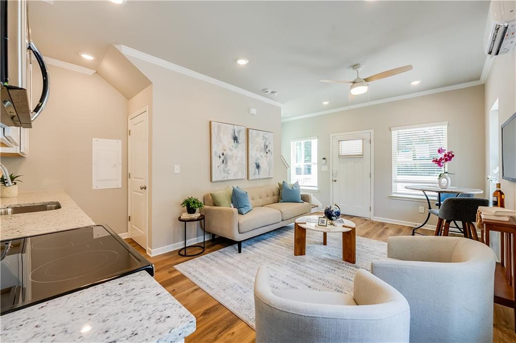 971 Peeples Street Southwest Atlanta, GA 30310 - Photo 3 of 16 a living room with furniture and wooden floor
