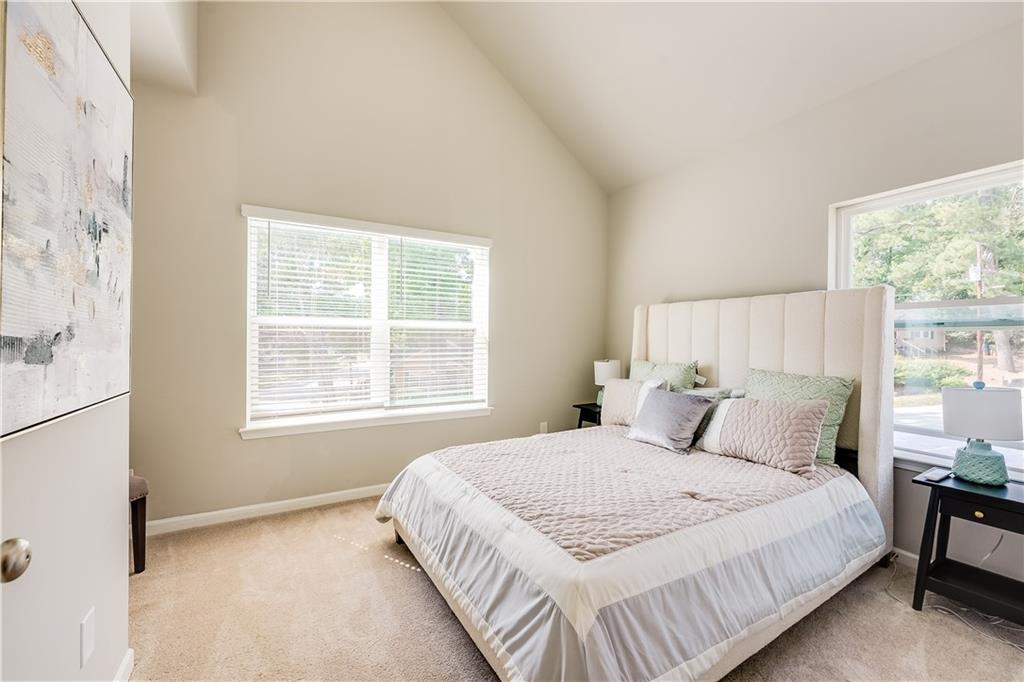 971 Peeples Street Southwest Atlanta, GA 30310 - Photo 9 of 16 a bedroom with a bed and a window