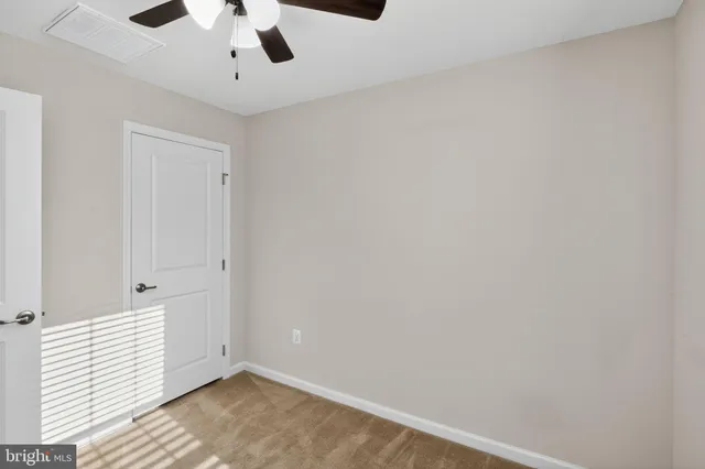 a bathroom with a bathtub shower sink vanity and toilet
