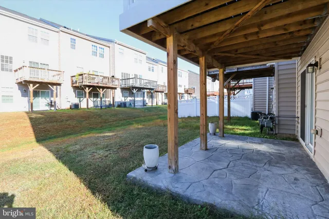 a front view of a house with a yard table and chairs