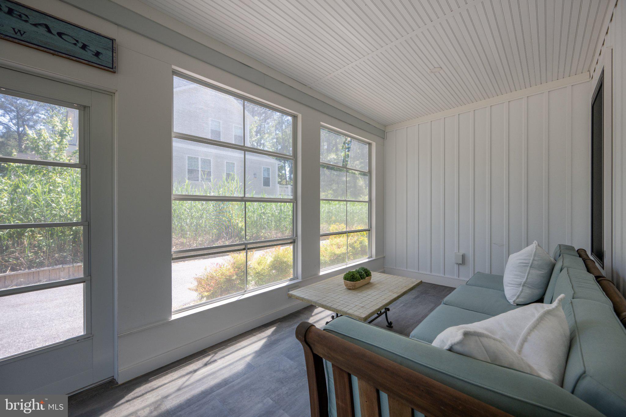 402 Salt Pond Road Bethany Beach, DE 19930 - Photo 10 of 55 Bright and airy sunroom retreat.