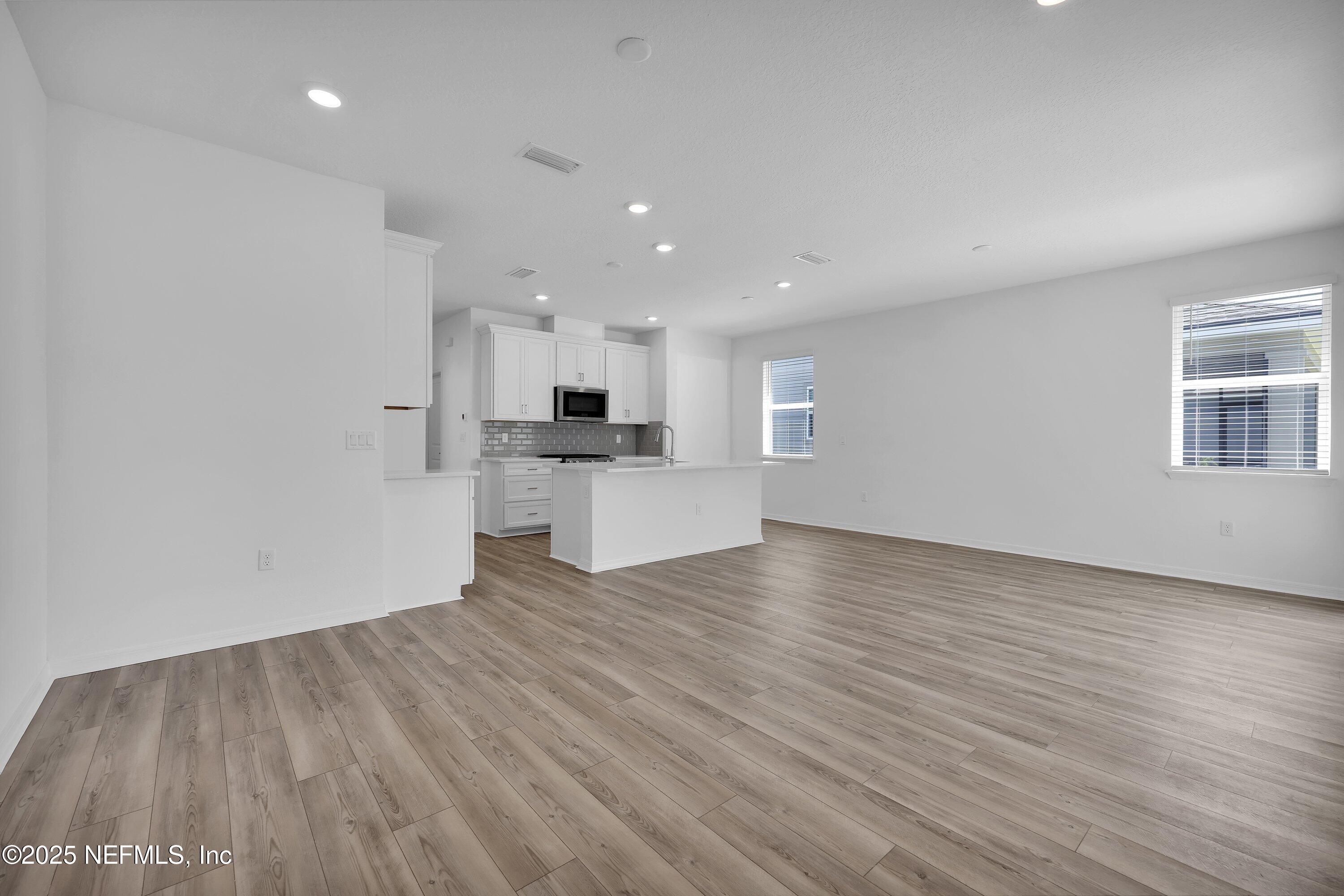 1749 Mickey Way Middleburg, FL 32068 - Photo 12 of 23 a view of kitchen with wooden floor and electronic appliances