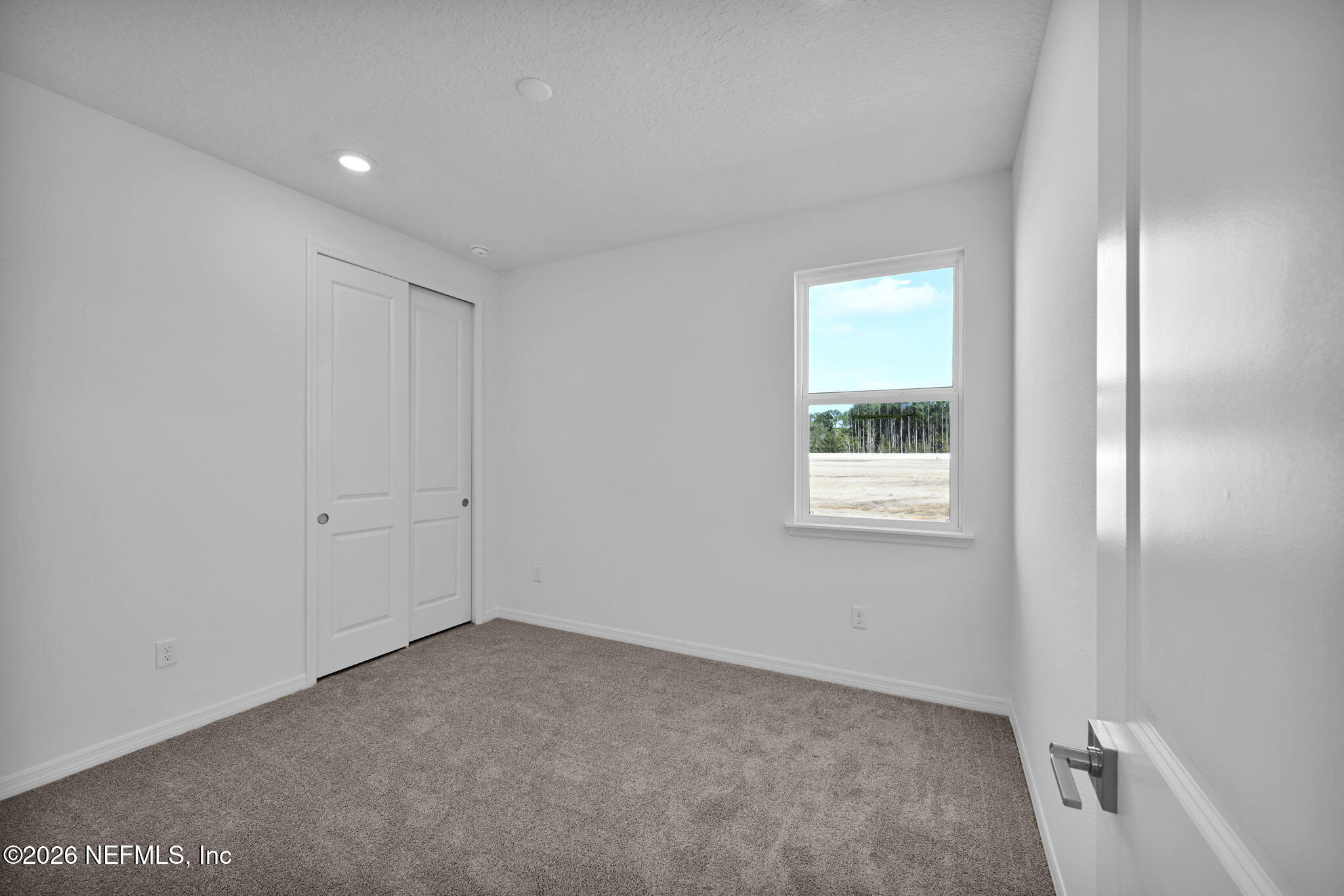 1749 Mickey Way Middleburg, FL 32068 - Photo 20 of 25 a view of an empty room and a window