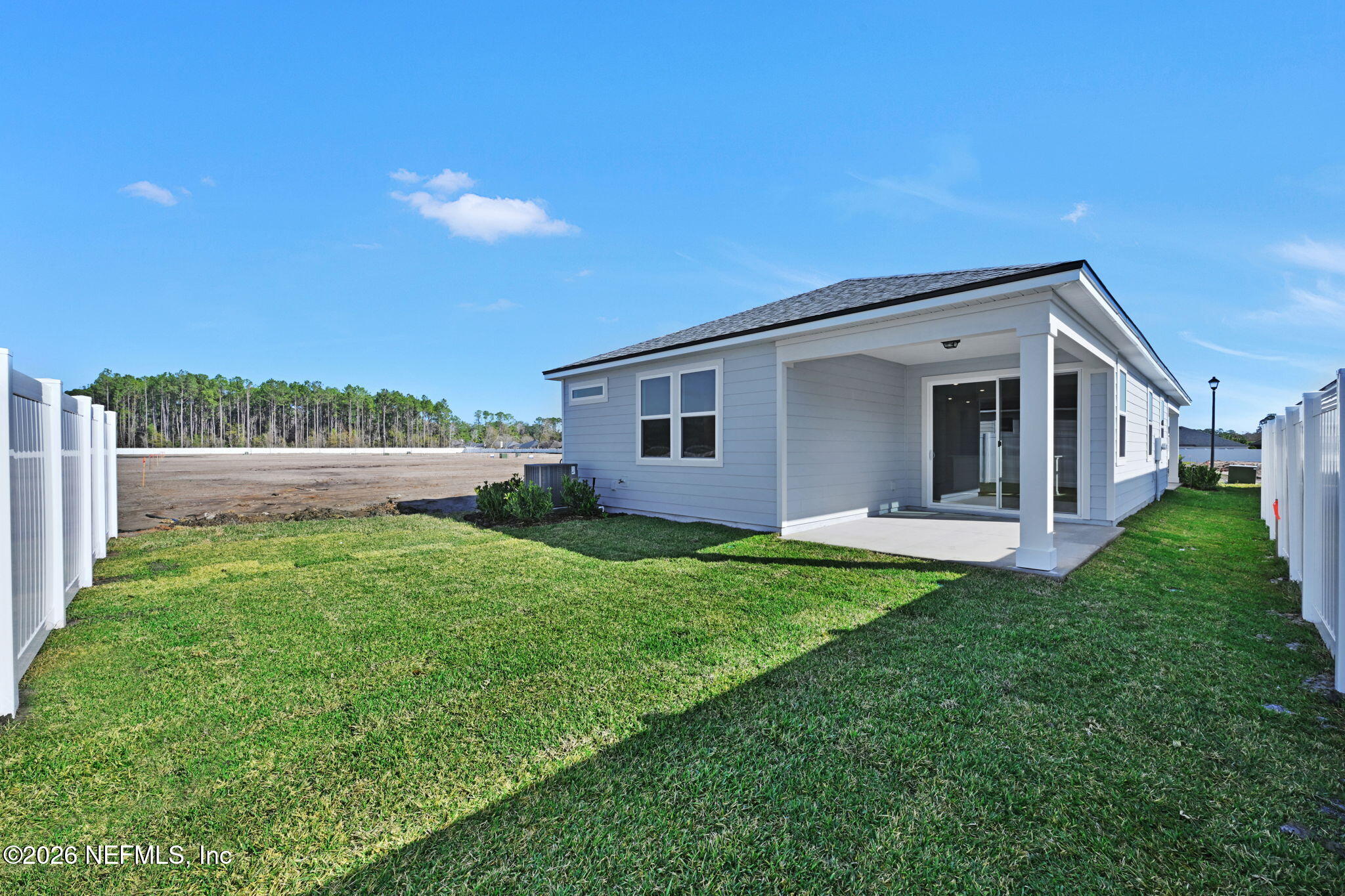 1749 Mickey Way Middleburg, FL 32068 - Photo 24 of 25 a view of an house with backyard space and garden