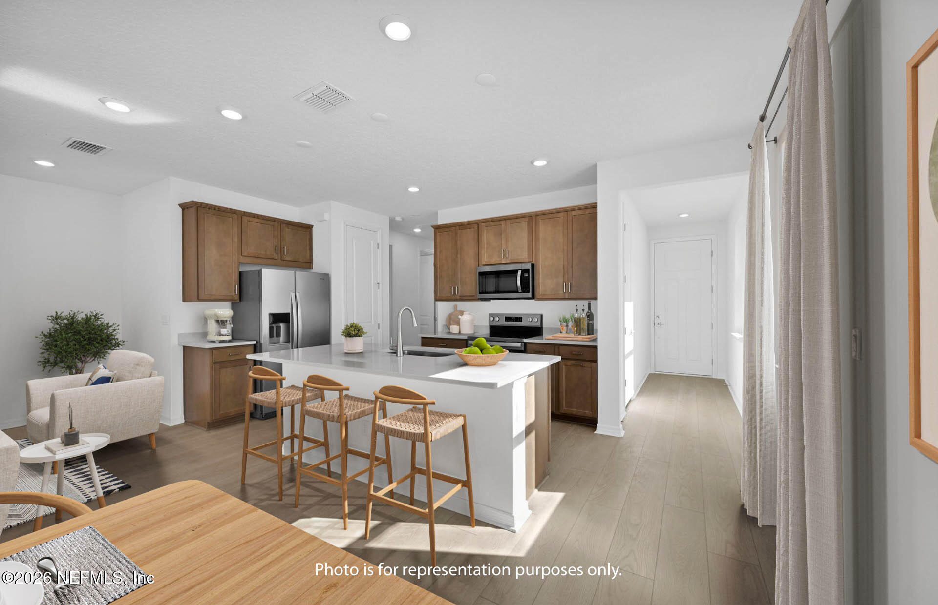 1749 Mickey Way Middleburg, FL 32068 - Photo 4 of 25 a kitchen with a table and chairs in it