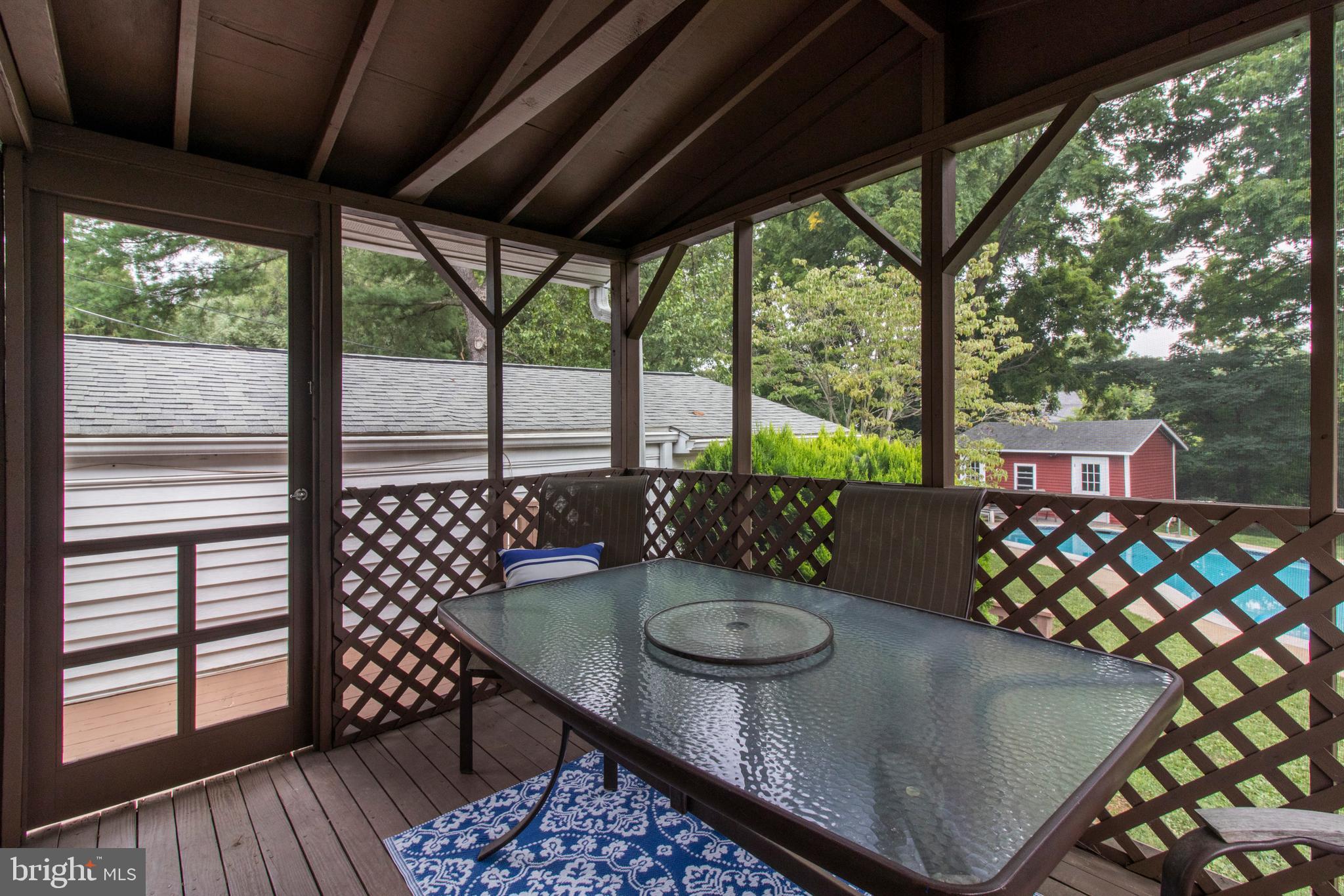 1705 Church Road Oreland, PA 19075 - Photo 11 of 35 Screened in porch heading out to the pool