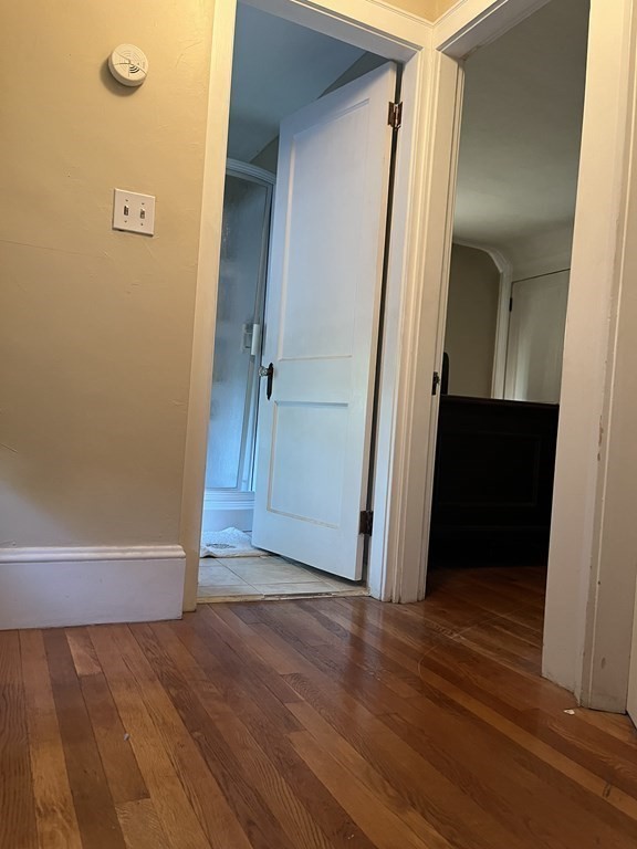 239 Plumtree Road Springfield, MA 01118 - Photo 13 of 14 an empty room with wooden floor and closet