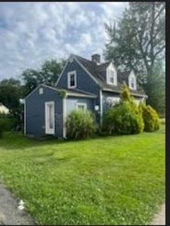 239 Plumtree Road Springfield, MA 01118 - Photo 2 of 14 a front view of house with yard and green space