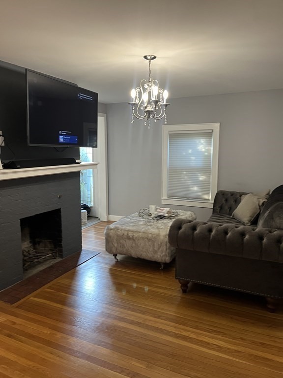 239 Plumtree Road Springfield, MA 01118 - Photo 9 of 14 a living room with furniture and a fireplace